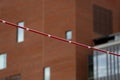 Pole Vault Crossbar on background of the building