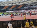 Pole vaulters talk with their coaches. Royalty Free Stock Photo