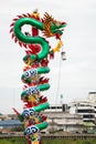 A pole wrapped around by Chinese Dragon