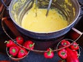 Polenta at the cauldron and red capia peppers - romanian traditional