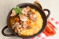 Polenta - corn porridge with stewed chicken in oil