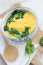Polenta (cornmeal boiled into a porridge) with cooked spinach