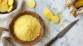 Polenta and cornmeal in wooden bowl with sliced cornmeal cakes on marble background Royalty Free Stock Photo