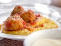 Polenta with meatballs in tomato sauce Royalty Free Stock Photo