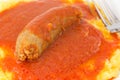 Polenta with tomato sauce with sausage