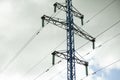 Poles of electric transmission lines. High voltage. Electrical wires against sky Royalty Free Stock Photo