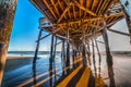 Poles under Newport Beach pier Royalty Free Stock Photo