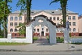POLESSK, RUSSIA. Decorative gate against the background of the office building
