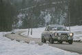 POLHOV GRADEC, SLOVENIA, 10.2.2023: Vintage Ford Escort is driving on snowy public road as part of a winter oldtimer rally
