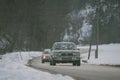 POLHOV GRADEC, SLOVENIA, 10.2.2023: Vintage Opel Ascona A series is driving on snowy public road as part of a winter oldtimer