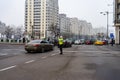 Police agent, Romanian Traffic Police Politia Rutiera directing traffic during the morning rush hour in downtown Bucharest,