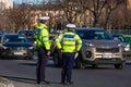 Police agents officers, Romanian Traffic Police (Politia Rutiera) directing traffic in junction during the morning traffic in