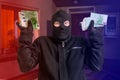 Police arrested masked thief in balaclava with stolen money