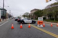 A police blocking traffic is seen near a road closed sign at a highway construction site