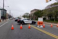 A police blocking traffic is seen near a road sign at a highway construction site