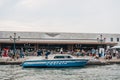 Police boat on Grand Canal outside Santa Lucia train station in Venice, Italy, view from water Royalty Free Stock Photo