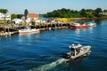 A police boat patrols the fishing harbor