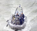 police boat on the Seine river with three officers Royalty Free Stock Photo