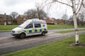 Police Camera Enforcement Unit Van parked at side of the road to enforce speed restrictions. Speed camera sign visable