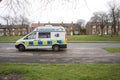 Police Camera Enforcement Unit Van parked at side of the road to enforce speed restrictions. Speed camera sign visable