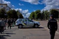 A police car blocks a city street to restrict vehicle traffic Royalty Free Stock Photo