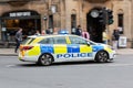 Police car on blue lights responding to an emergency seen Oxford city centre