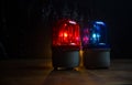 Police car blue and red round vintage siren in dark. Rotating retro style police siren in dark