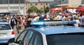 police car with flashing lights above during escort and protest Royalty Free Stock Photo