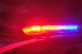 Police car flashing lights in the night selective focus Royalty Free Stock Photo