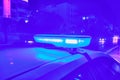 Police car flashing lights in the night selective focus Royalty Free Stock Photo