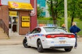 Police Car In Front Of A Money Mart