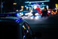 Police car lights at night in city with selective focus and boke blur Royalty Free Stock Photo