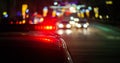 Police car lights in night city with selective focus and bokeh Royalty Free Stock Photo