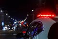 police car lights in night city with selective focus and bokeh Royalty Free Stock Photo