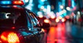 police car lights at night in city street with selective focus and bokeh Royalty Free Stock Photo
