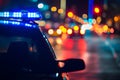 police car lights at night in city street with selective focus and bokeh Royalty Free Stock Photo