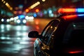 police car lights at night in city street with selective focus and bokeh Royalty Free Stock Photo