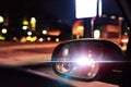 Police car lights reflected on the rearview mirror of a parked c Royalty Free Stock Photo