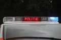 Police car in the netherlands with blue flash lights and text in roof console with STOP POLITIE Royalty Free Stock Photo