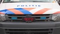 Police car in the Netherlands with logo, Politie text on front and sign STOP