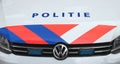 Police car in the Netherlands with logo, Politie text on front and sign STOP