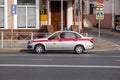a police car is parked on a city street, a police officer is sitting in a car, Russian State Security Service