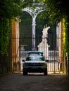 Police car parked in front of Colonnade Grove, Gardens of Versailles, France