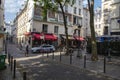 A police car and pedestrian at a Latin Quarter street corner Paris