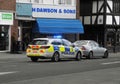 A Police car pulling up a car in the street. March 2020