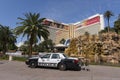 A police car sits in front of the Mirage hotel in Las Vegas.