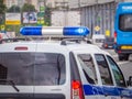 Police car in a stream of cars on a wide city road. Closeup rear view. Moscow, Russia - July 12, 2019