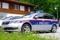 police car on streets of Austria, law enforcement officers guarding order on vehicles, patrolling, sending law enforcement