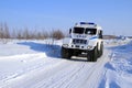 Police car TREKOL rides in the snow in the North of Siberia Royalty Free Stock Photo