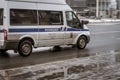 police car van is passing by on the road. Police van Ford Transit in the city street in motion. Car of Department of Ministry of Royalty Free Stock Photo